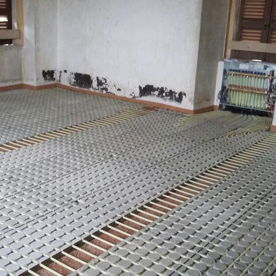 Radiant heating system with cement bonded particle boards